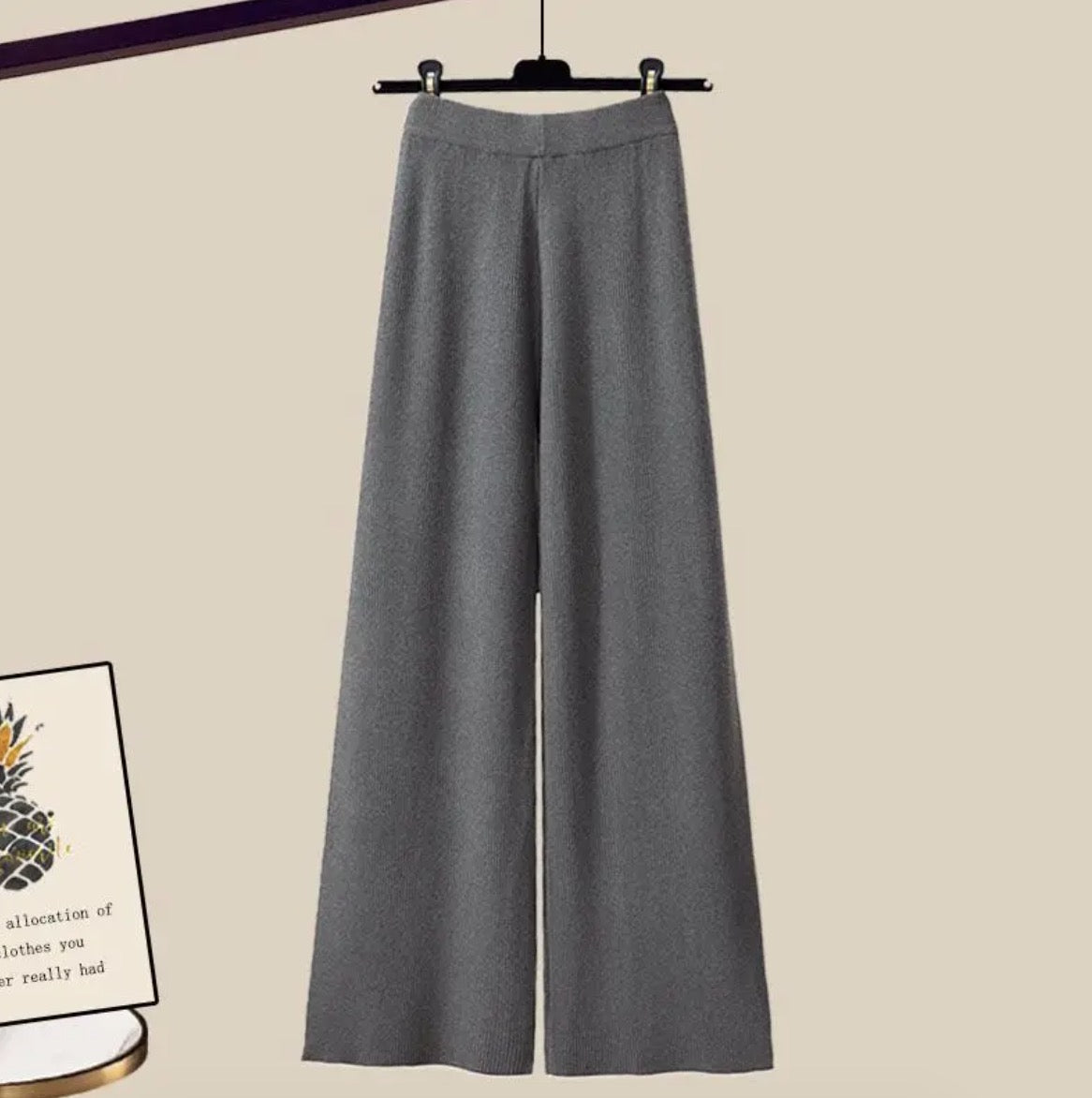 Lorelei three-piece women's set with flared pants, a long-sleeve blouse, and a sleeveless woven top.