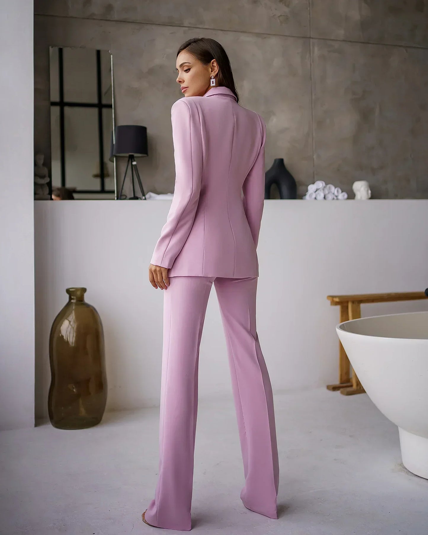 Eliana elegant suit set with a tailored blazer and straight pants, showing a polished, structured look.