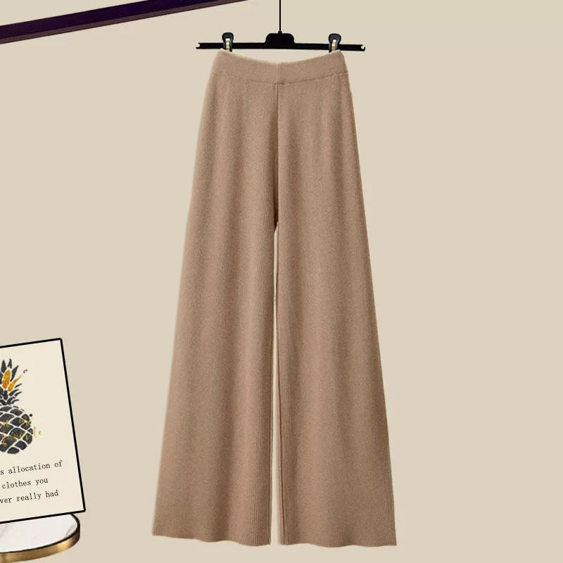 Lorelei three-piece women's set with flared pants, a long-sleeve blouse, and a sleeveless woven top.