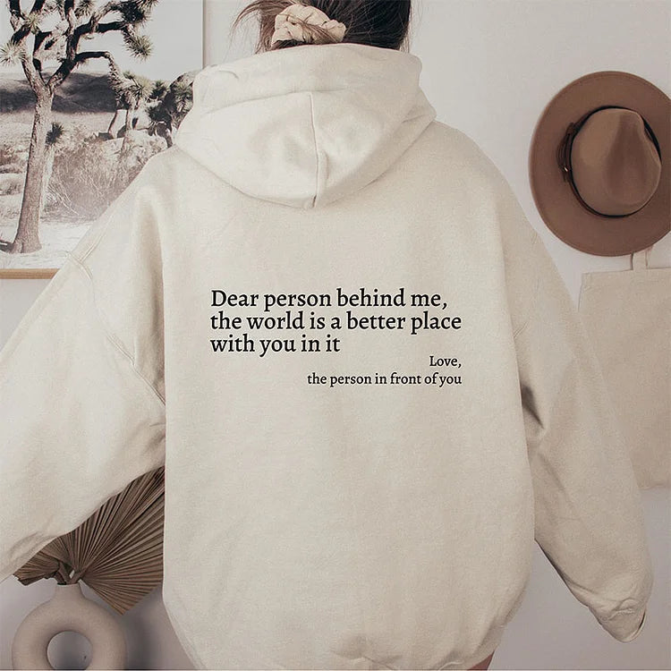 Joy unisex hoodie with an inspiring quote printed on the back.