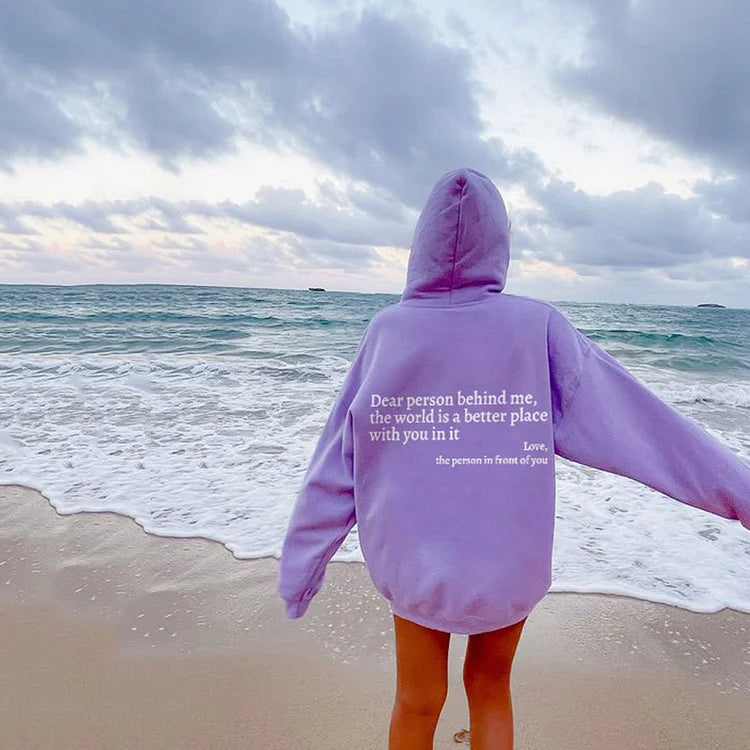 Joy unisex hoodie with an inspiring quote printed on the back.