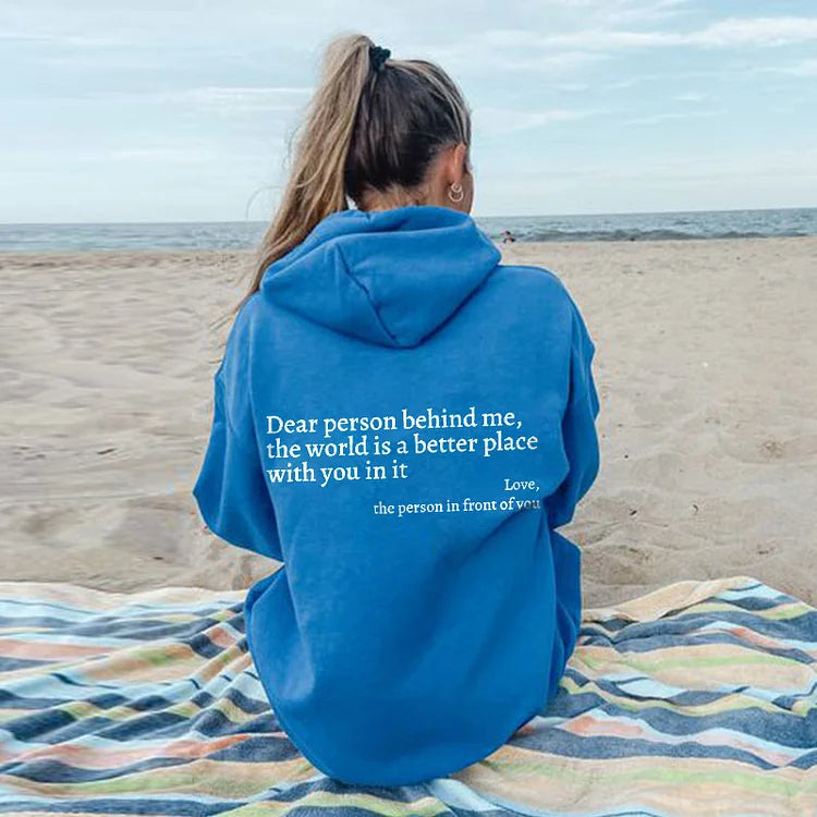 Joy unisex hoodie with an inspiring quote printed on the back.