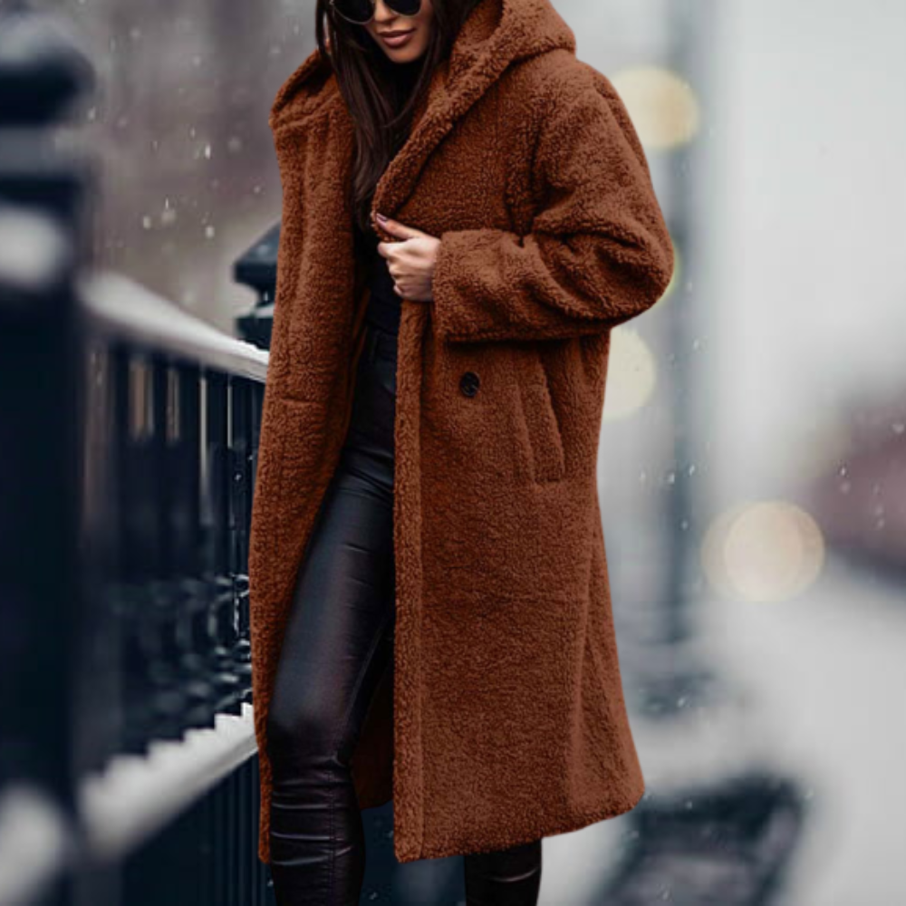 Fiorella women’s long polar style coat with tailored silhouette and flowing design for winter elegance