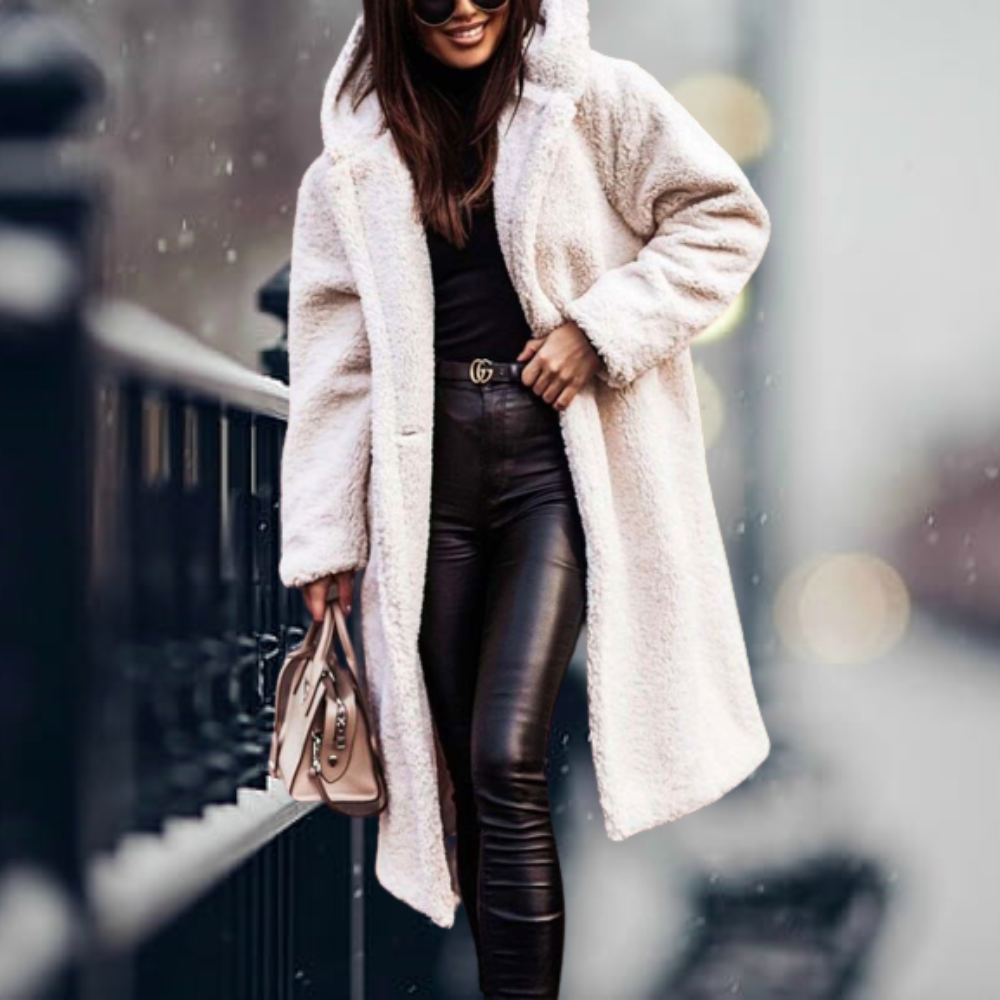 Fiorella women’s long polar style coat with tailored silhouette and flowing design for winter elegance