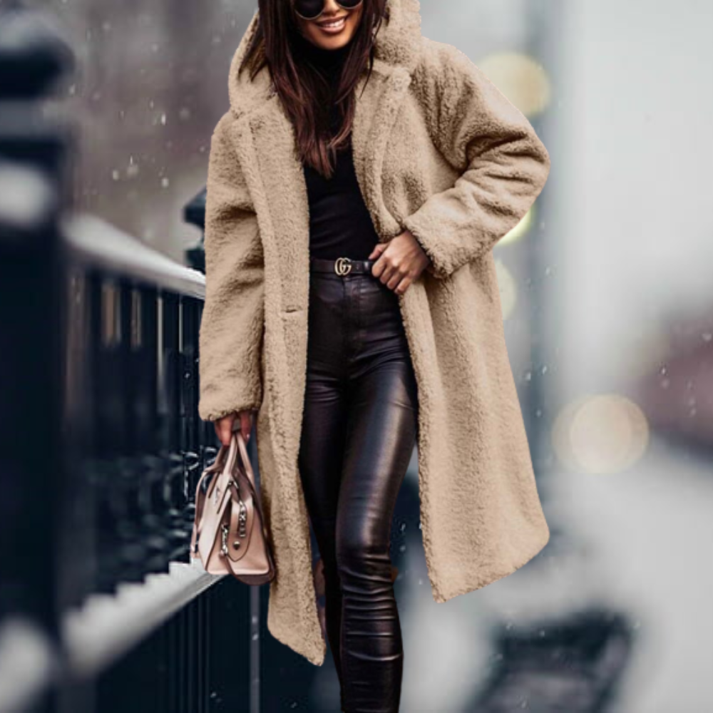 Fiorella women’s long polar style coat with tailored silhouette and flowing design for winter elegance