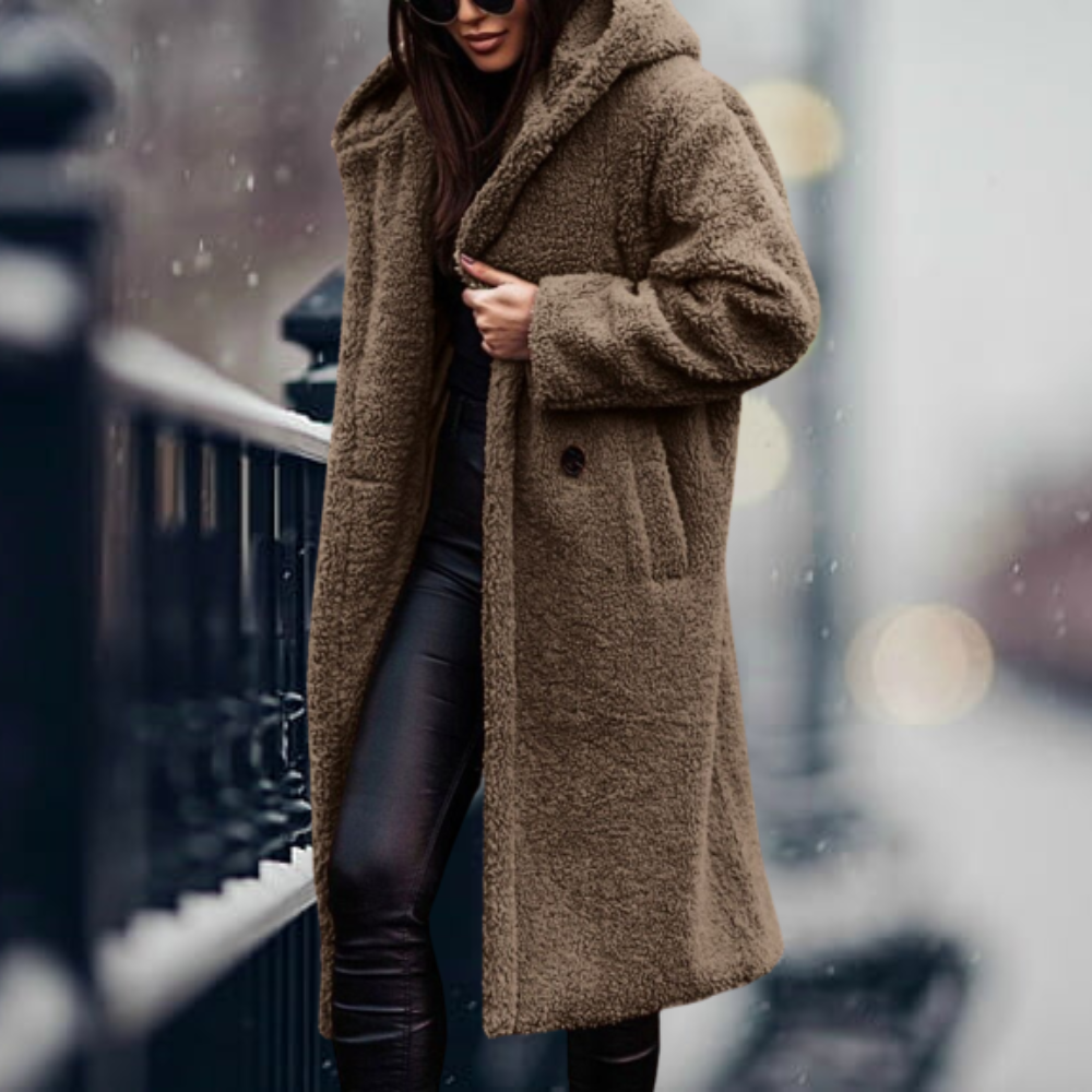 Fiorella women’s long polar style coat with tailored silhouette and flowing design for winter elegance