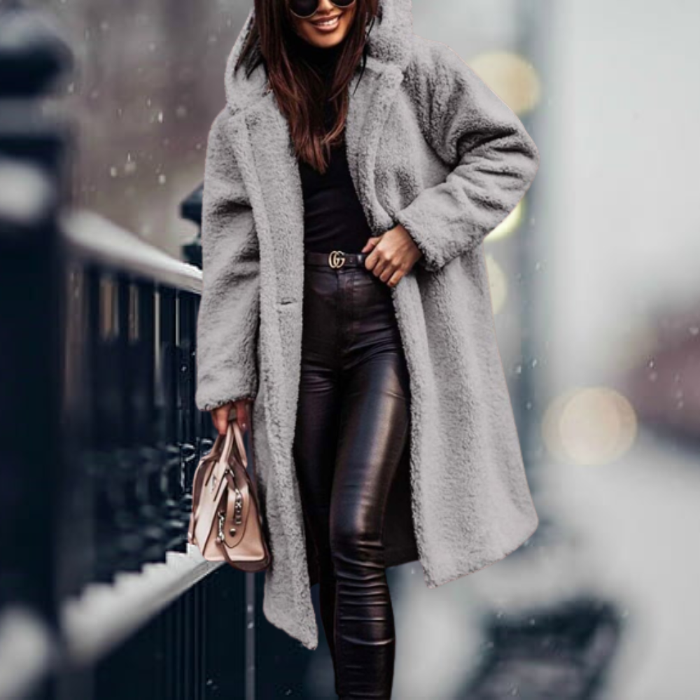 Fiorella women’s long polar style coat with tailored silhouette and flowing design for winter elegance