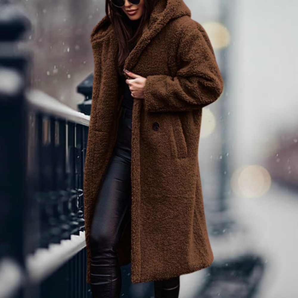 Fiorella women’s long polar style coat with tailored silhouette and flowing design for winter elegance