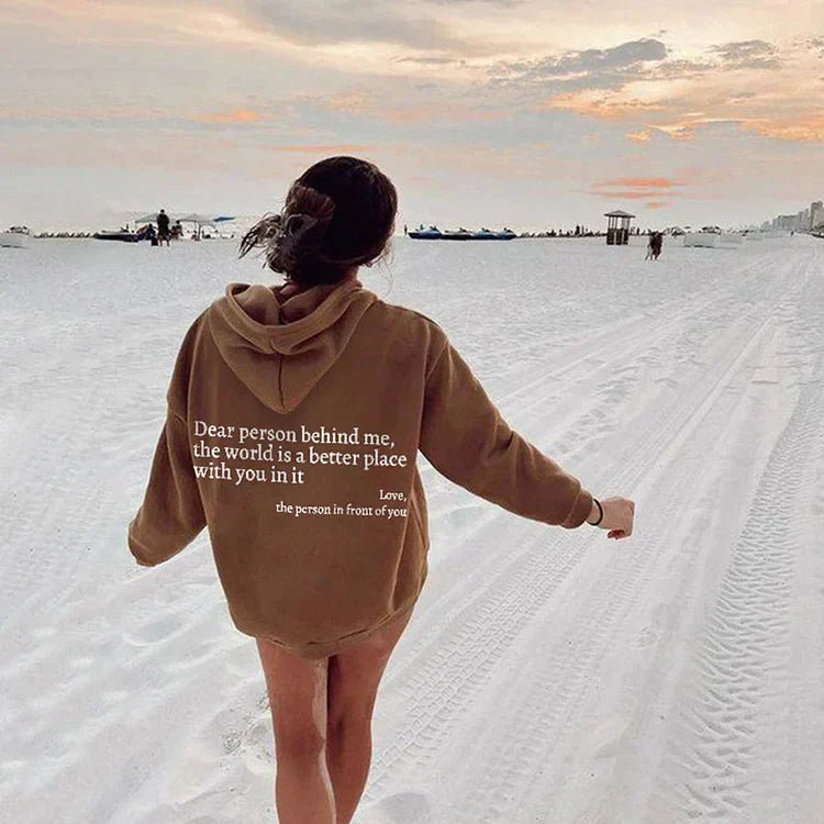 Joy unisex hoodie with an inspiring quote printed on the back.