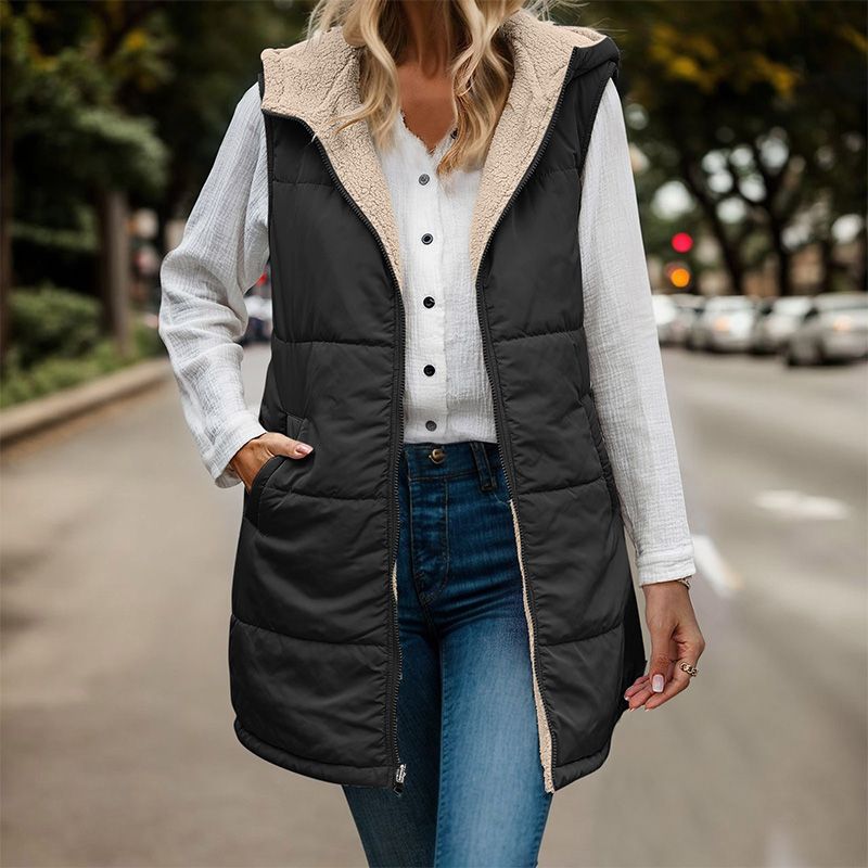 Anya reversible sleeveless jacket featuring one side with textured fleece and the other with a smooth, sleek finish.