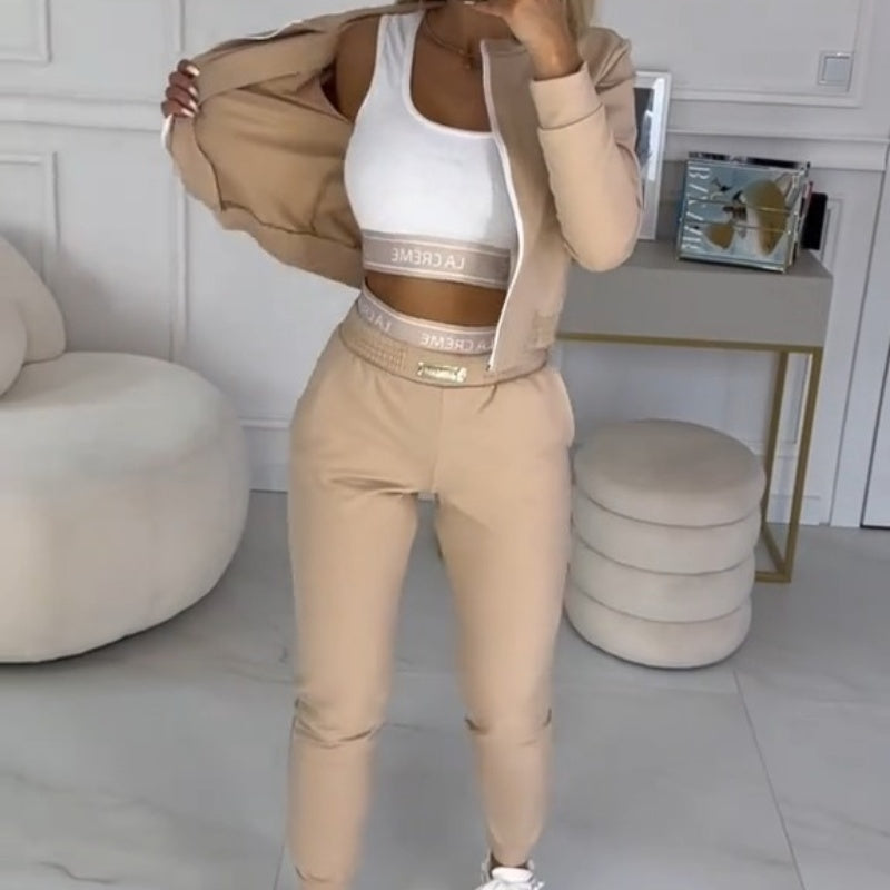Sienna 3-piece tracksuit for women, with a zip-up hooded jacket, matching top, and comfortable pants.