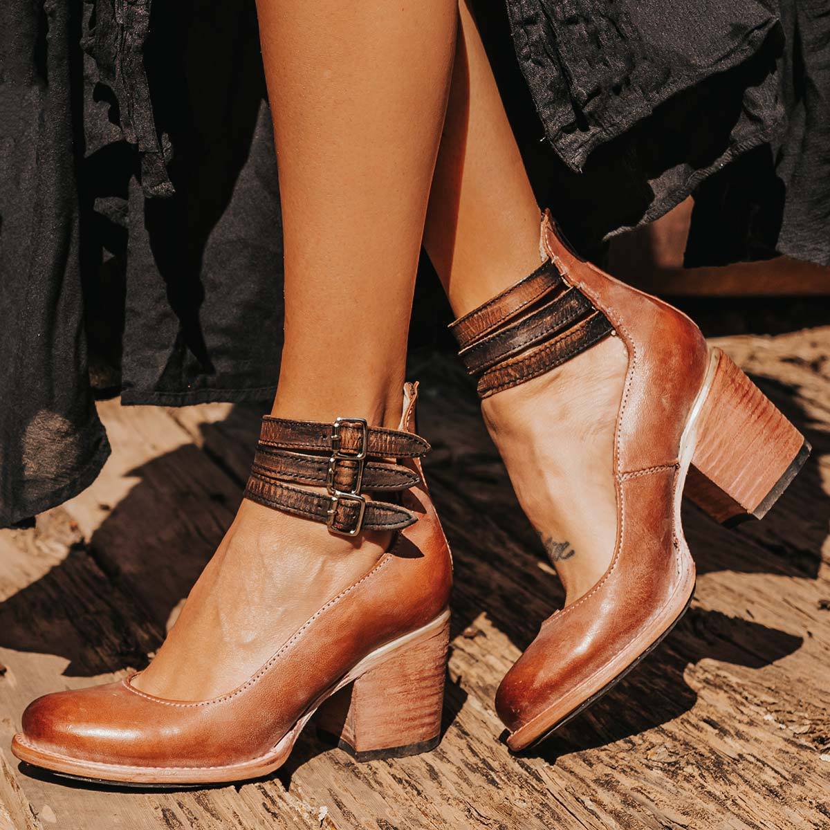 Amara women's elegant heels with a triple strap design and a sleek, modern silhouette.