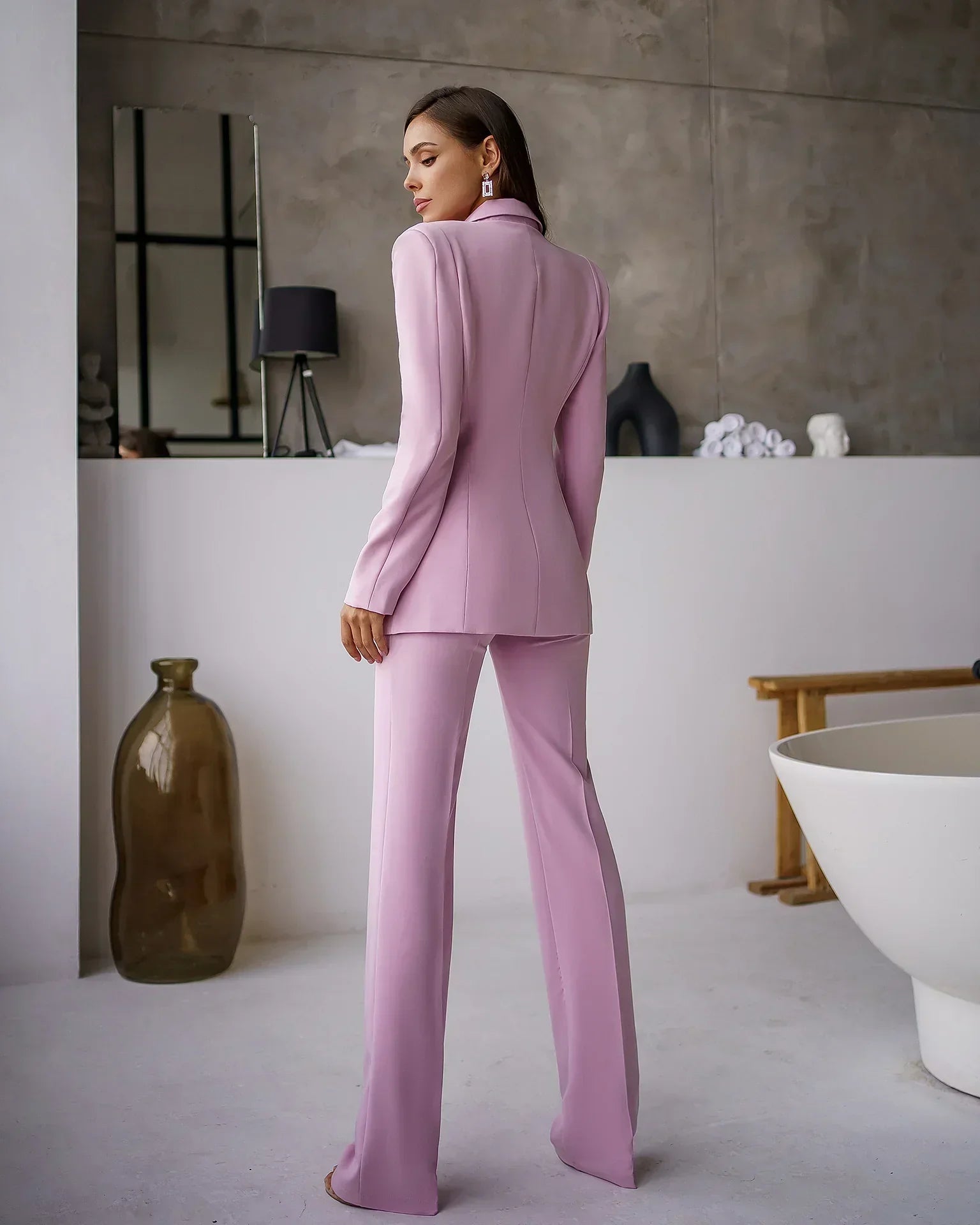 Eliana elegant suit set with a tailored blazer and straight pants, showing a polished, structured look.