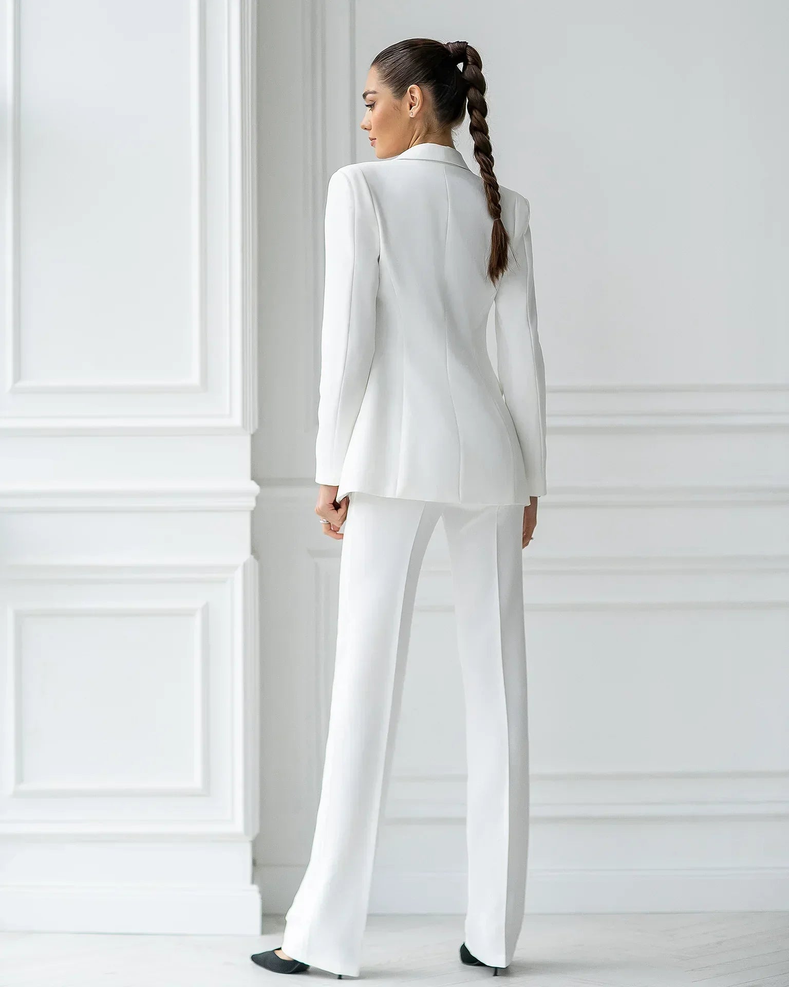 Eliana elegant suit set with a tailored blazer and straight pants, showing a polished, structured look.
