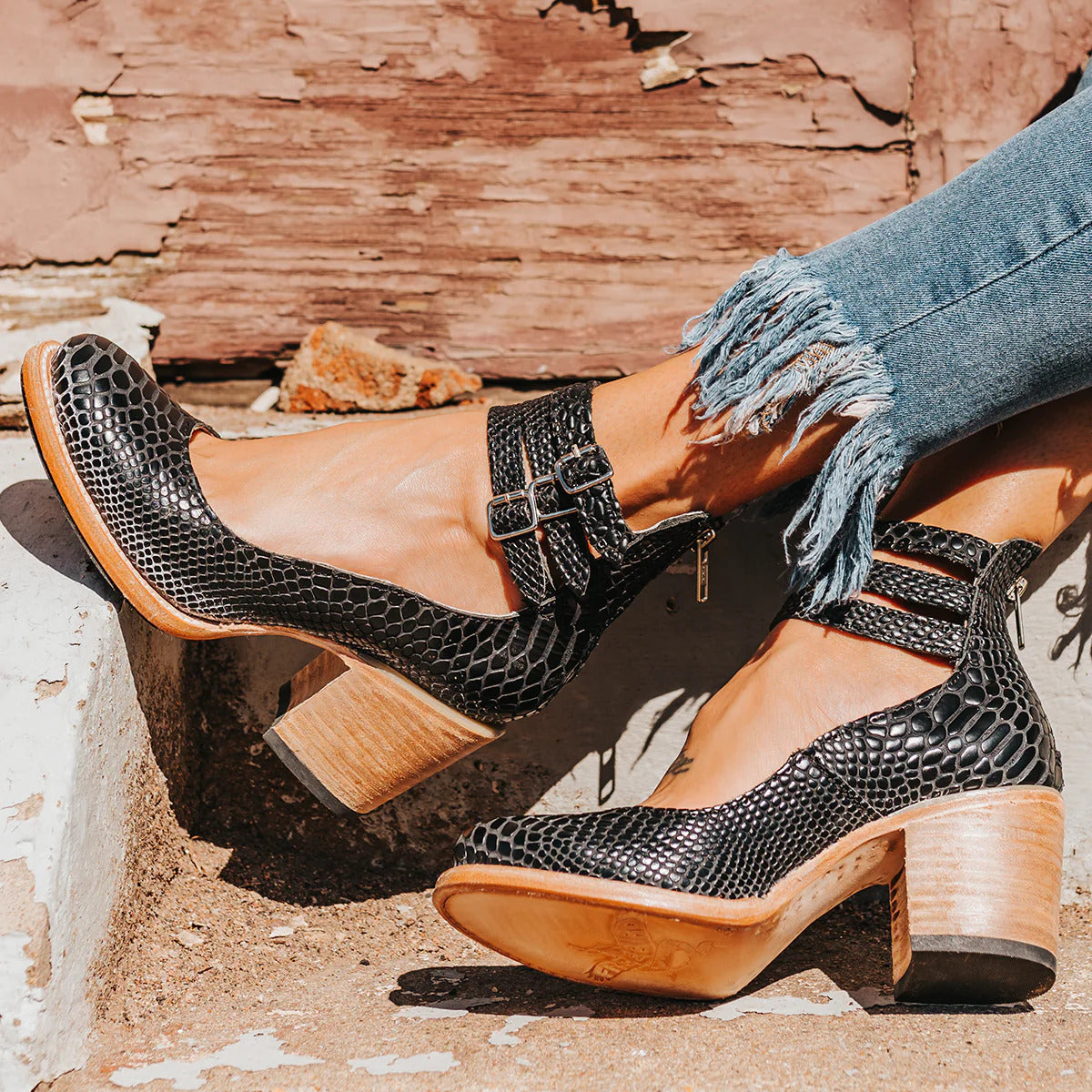 Amara women's elegant heels with a triple strap design and a sleek, modern silhouette.