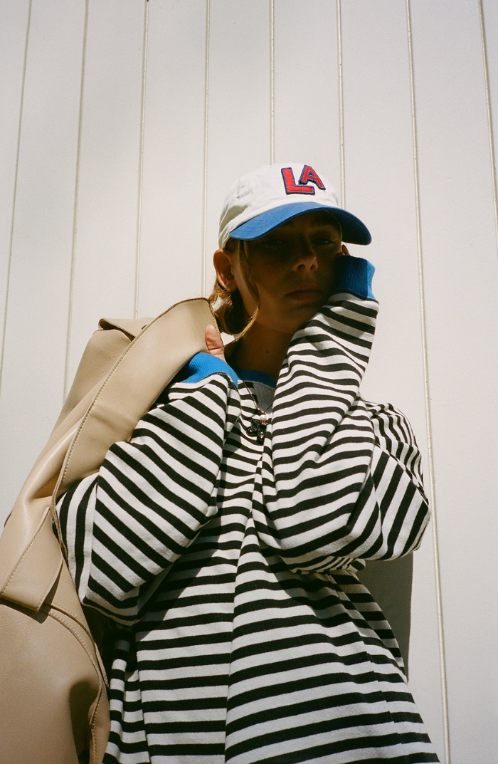 Lena oversized women's sweater with a black and white striped pattern and a round neck.