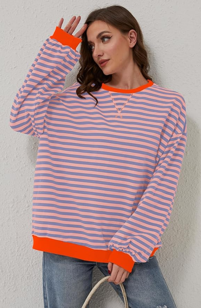 Lena oversized women's sweater with a black and white striped pattern and a round neck.