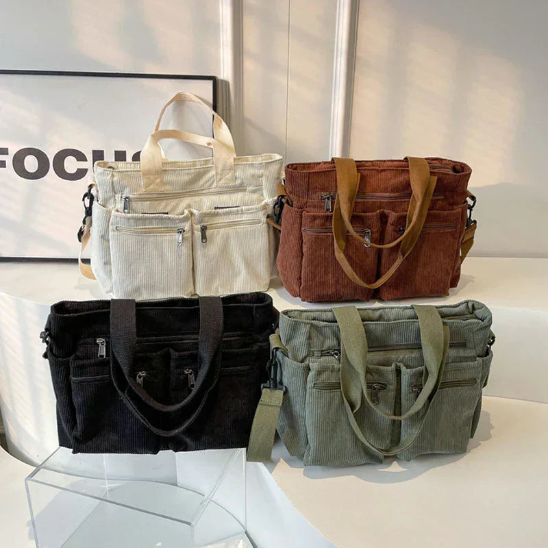 Celina women's handbag with a sleek, structured shape and two main zippered compartments.