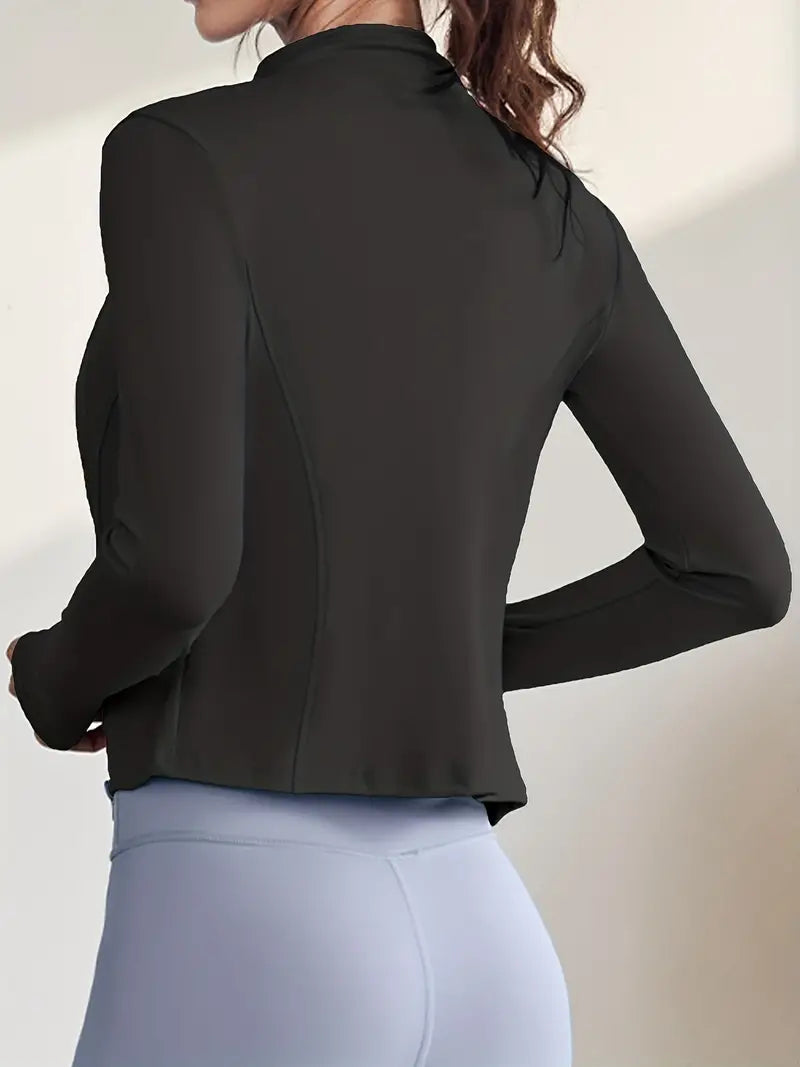 Zella women's sports jacket with a fitted cut, full zip, high collar, and thumb holes.