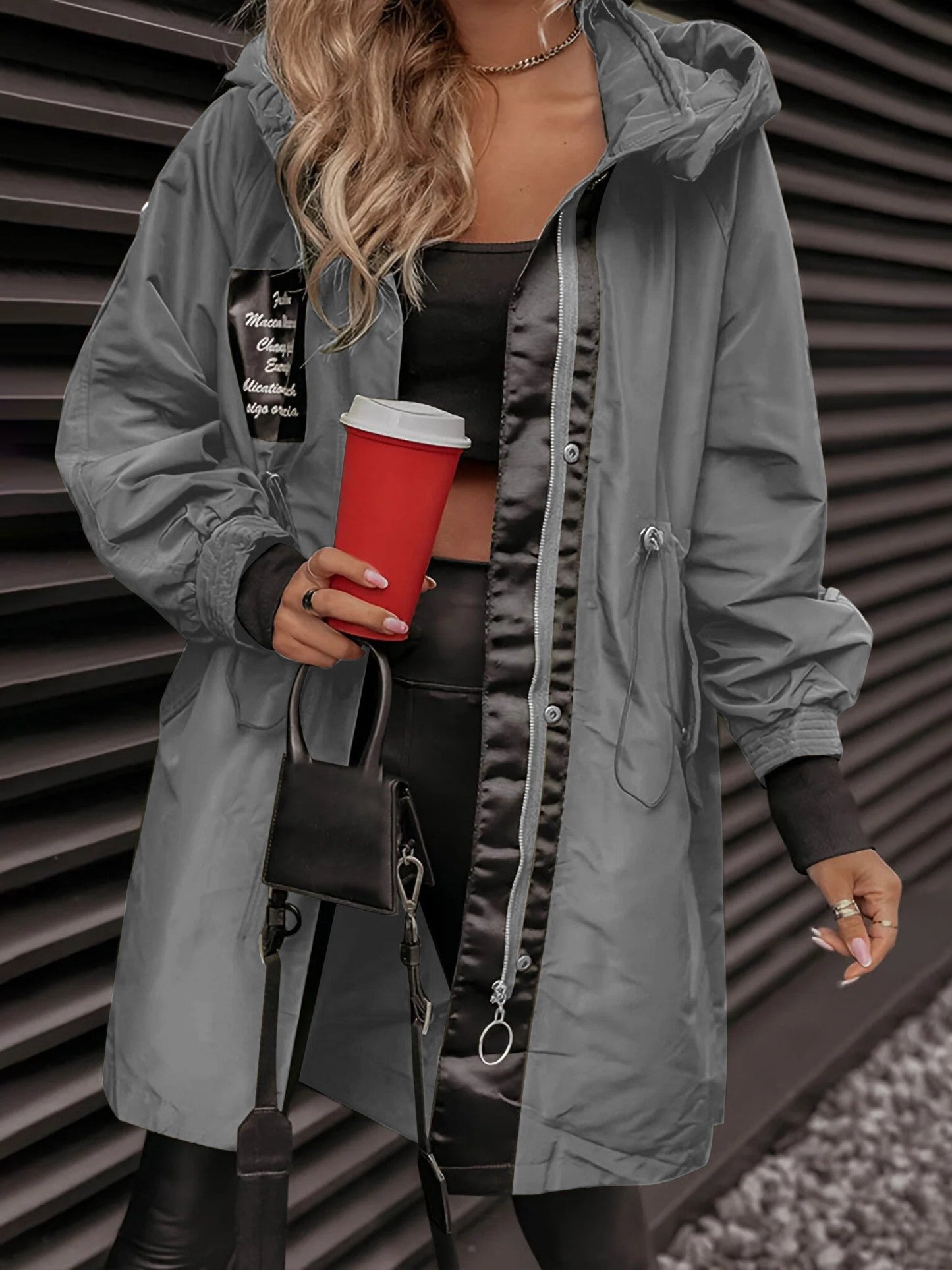 Naomi long sleeve hooded jacket for women, featuring a front zipper and an adjustable hood for warmth and style.