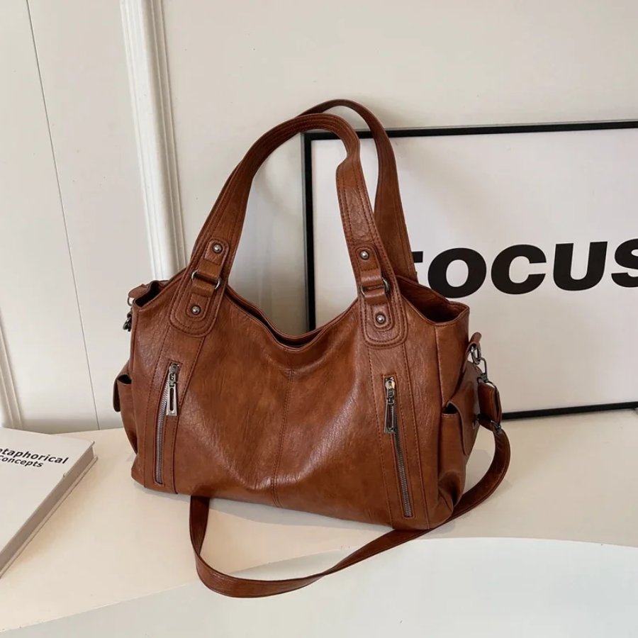 Lyra women’s practical synthetic leather shoulder bag with adjustable strap