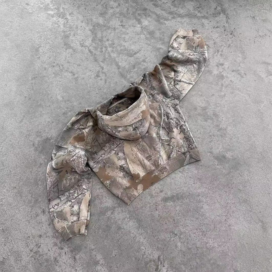 Hayden unisex hoodie with a camouflage pattern, zip closure, and a comfortable, relaxed fit.