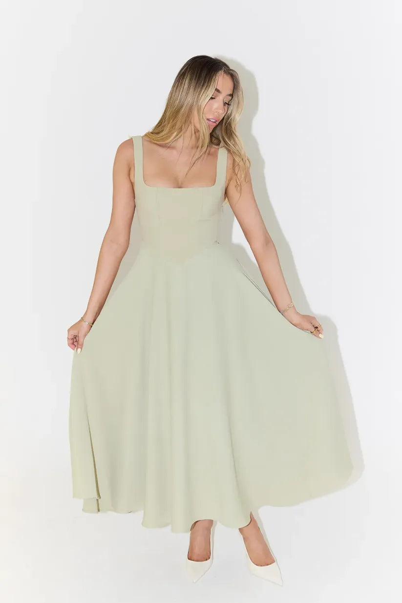 Clara women's midi dress with a high waist, square neckline, and a flowing skirt, in a solid color.