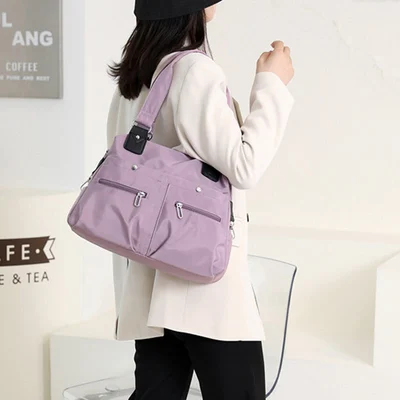 Amelie lightweight handbag with a structured shape and a clean, modern design.