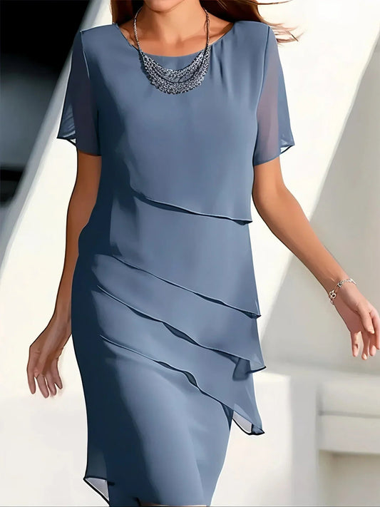 Elara women’s cocktail dress with layered diagonal ruffles and knee-length silhouette