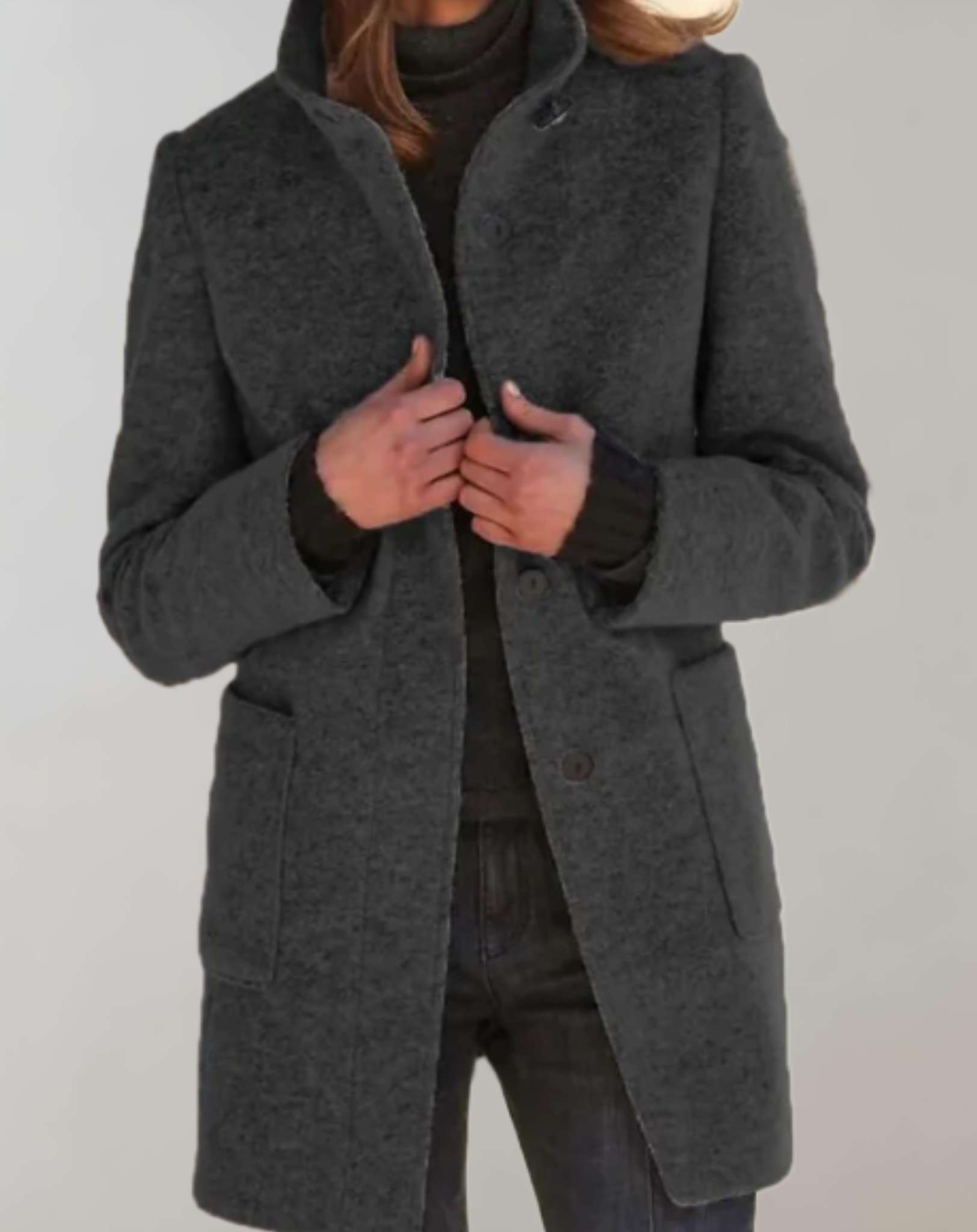 Eleanor women's midi length wool coat with a high collar and fluid silhouette.