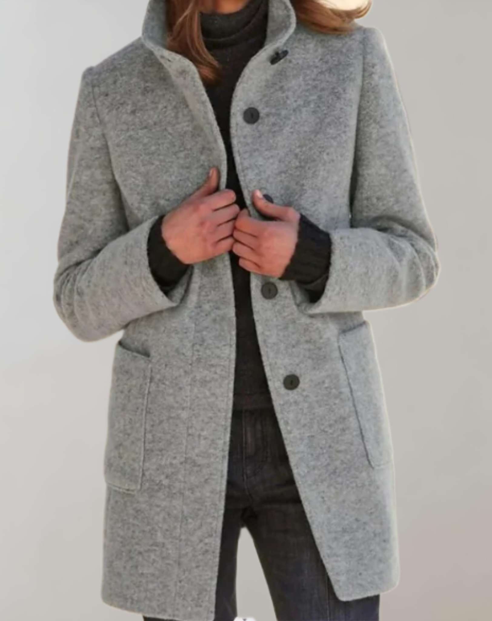 Eleanor women's midi length wool coat with a high collar and fluid silhouette.