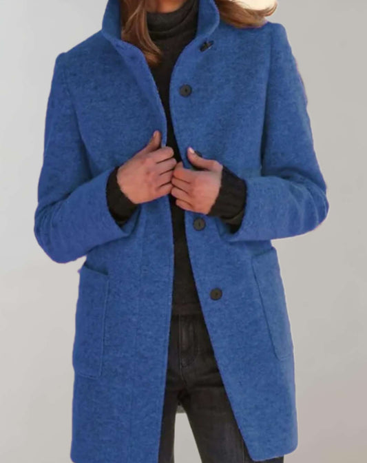 Eleanor women's midi length wool coat with a high collar and fluid silhouette.