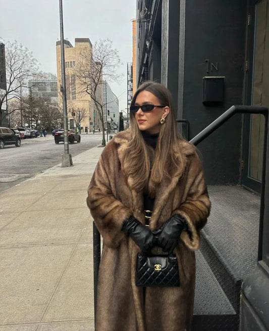 Skylar elegant faux fur coat for women with a fluid, enveloping design and luxurious texture.