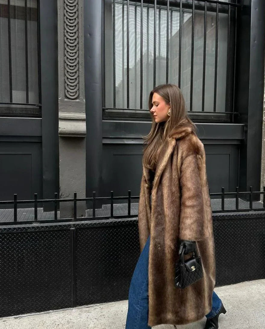 Skylar elegant faux fur coat for women with a fluid, enveloping design and luxurious texture.