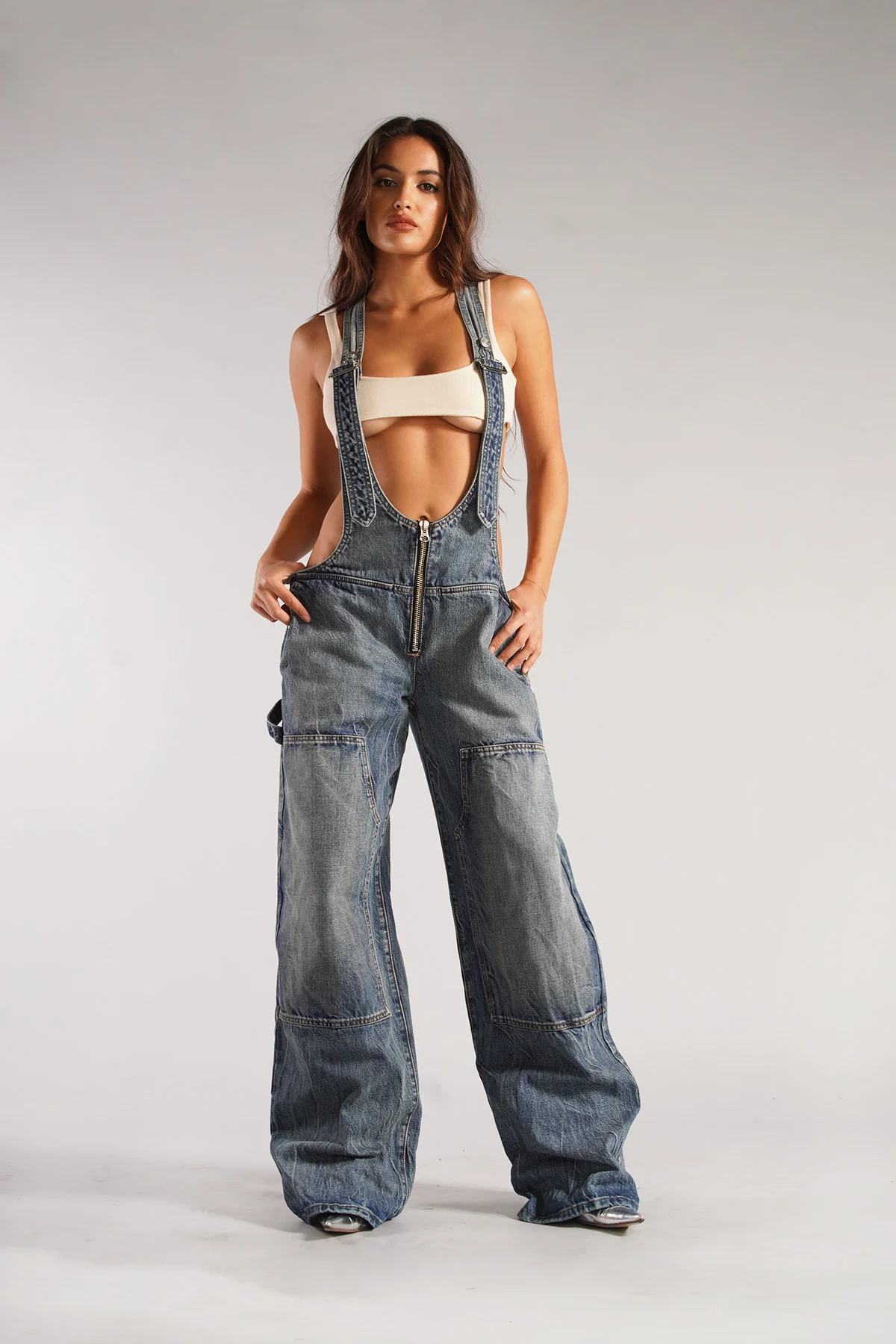 Marisol women’s denim jumpsuit with deep V-neck and tailored fit, bold and contemporary style