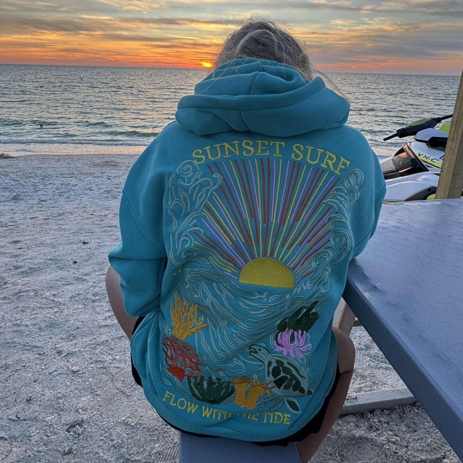 Unisex hoodie with coastal-inspired “SUNSET SURF” print – Mariner