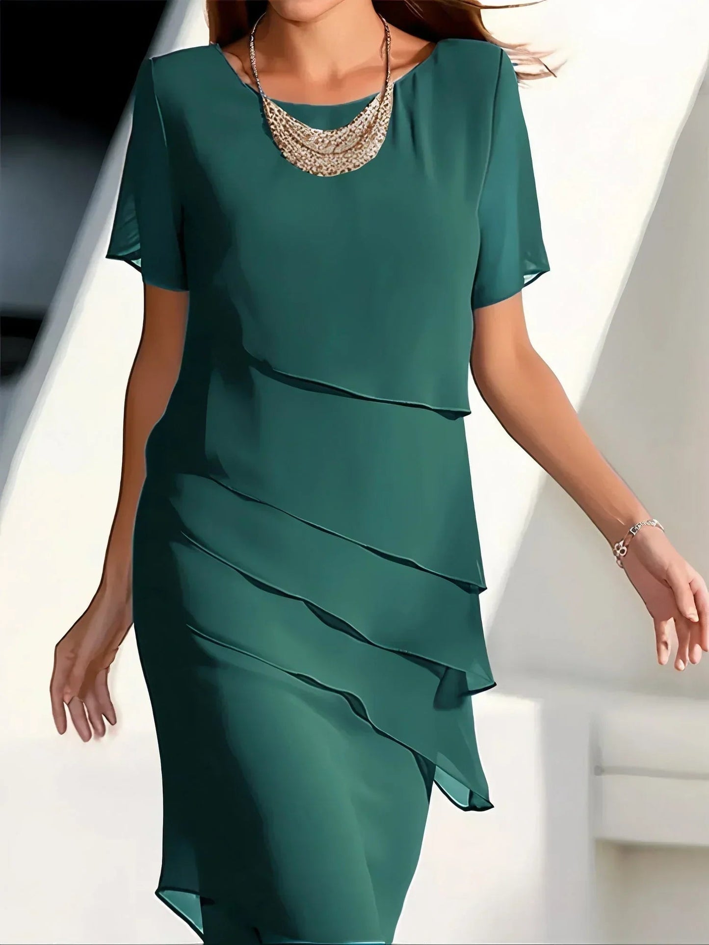 Elara women’s cocktail dress with layered diagonal ruffles and knee-length silhouette