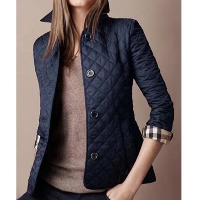 Elara women’s winter jacket with high collar and diamond pattern, tailored fit for winter style
