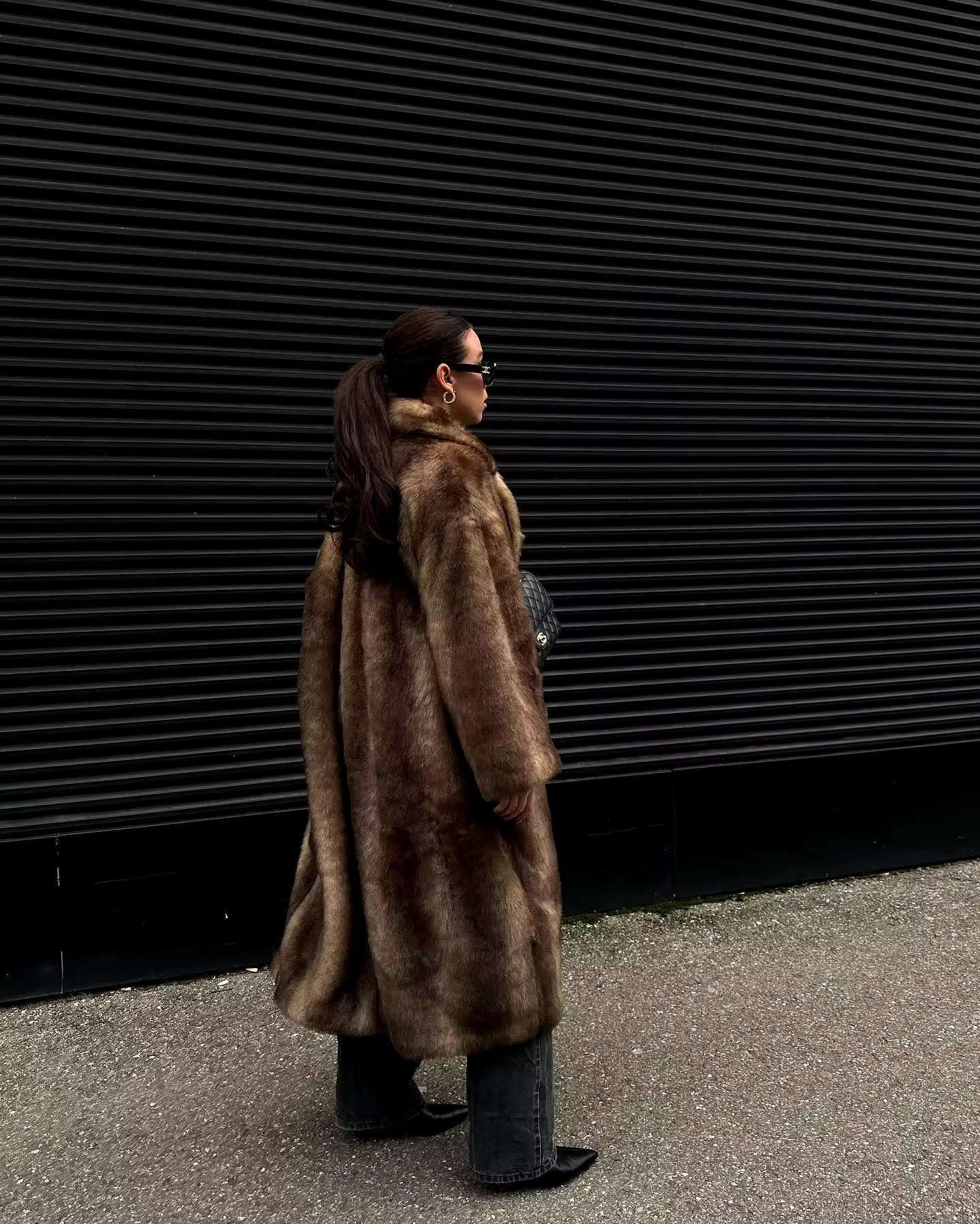 Skylar elegant faux fur coat for women with a fluid, enveloping design and luxurious texture.