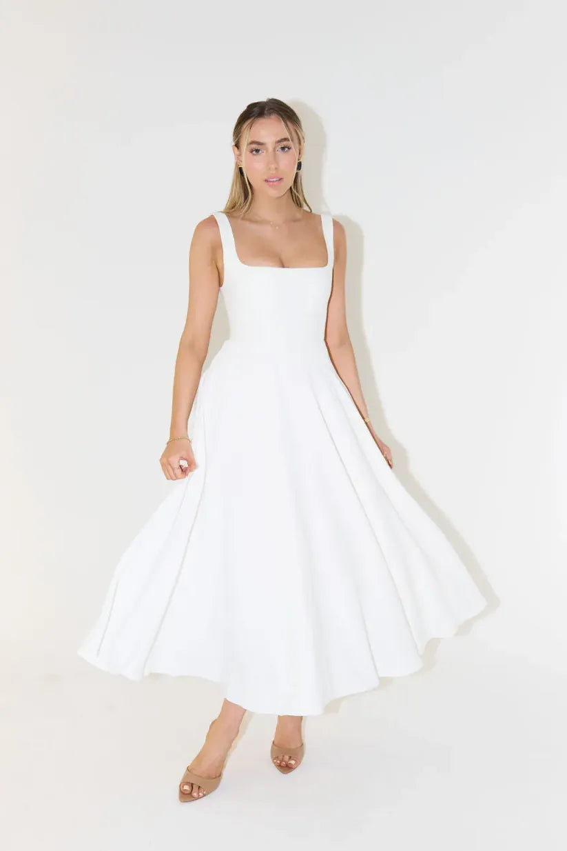 Clara women's midi dress with a high waist, square neckline, and a flowing skirt, in a solid color.