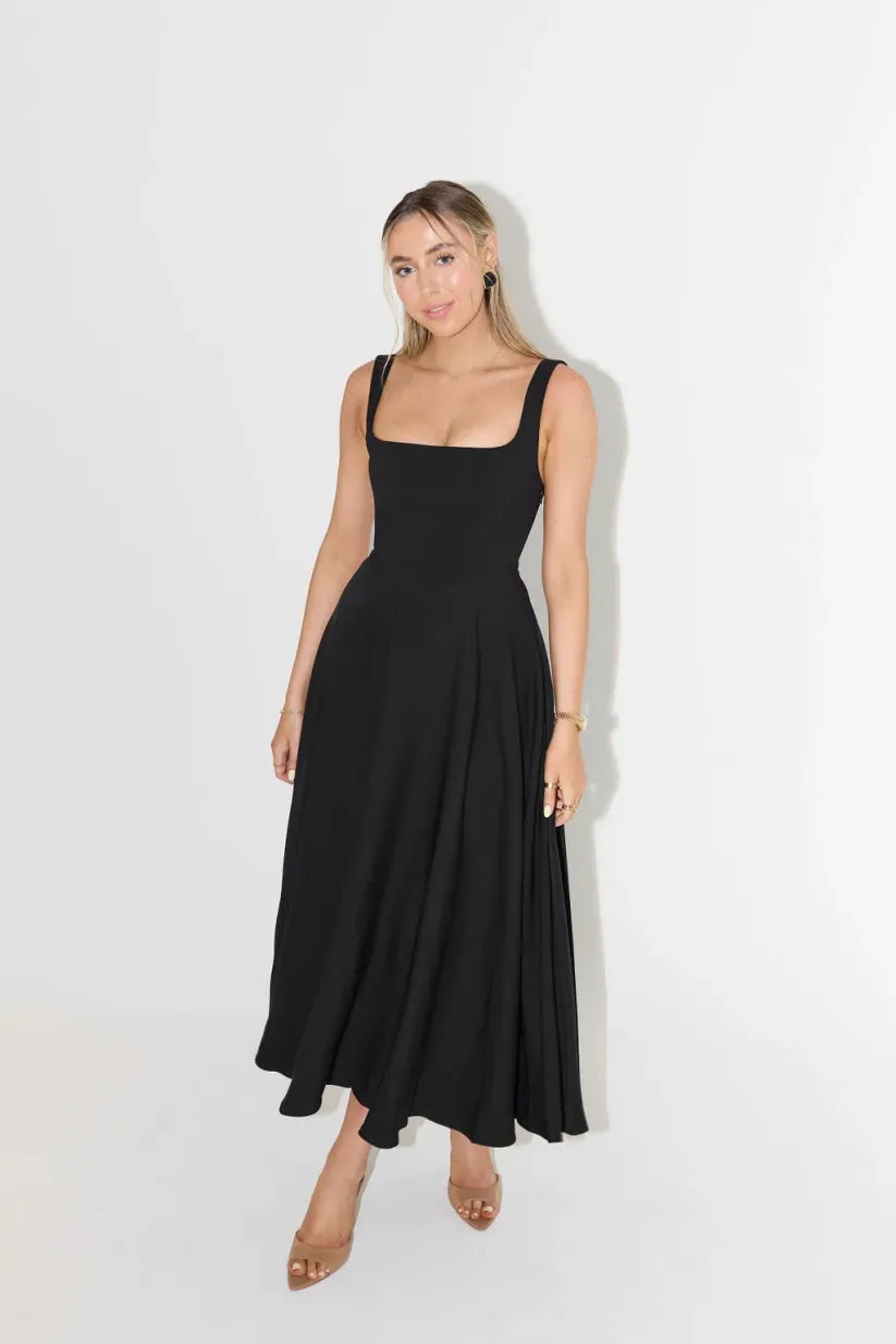 Clara women's midi dress with a high waist, square neckline, and a flowing skirt, in a solid color.