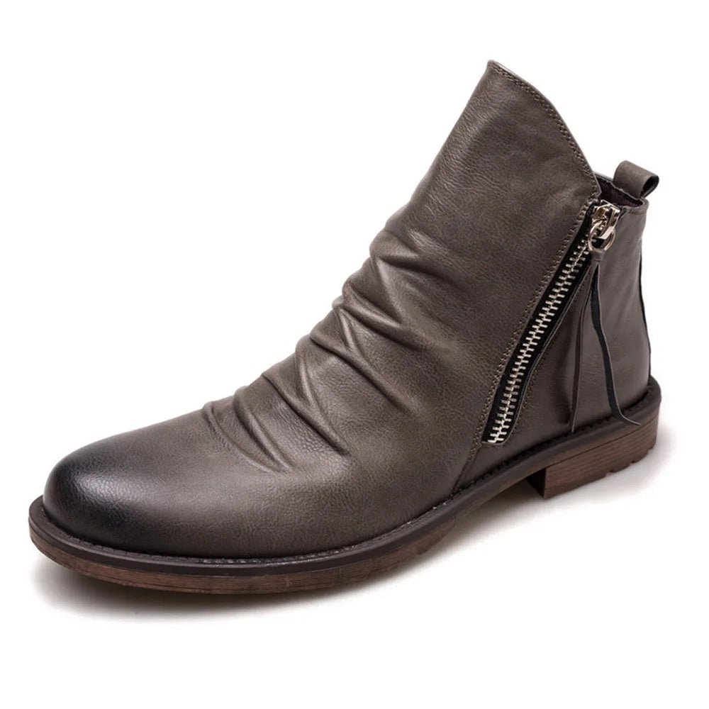 Keaton men's faux leather boots with a sleek Chelsea cut and a sturdy sole.