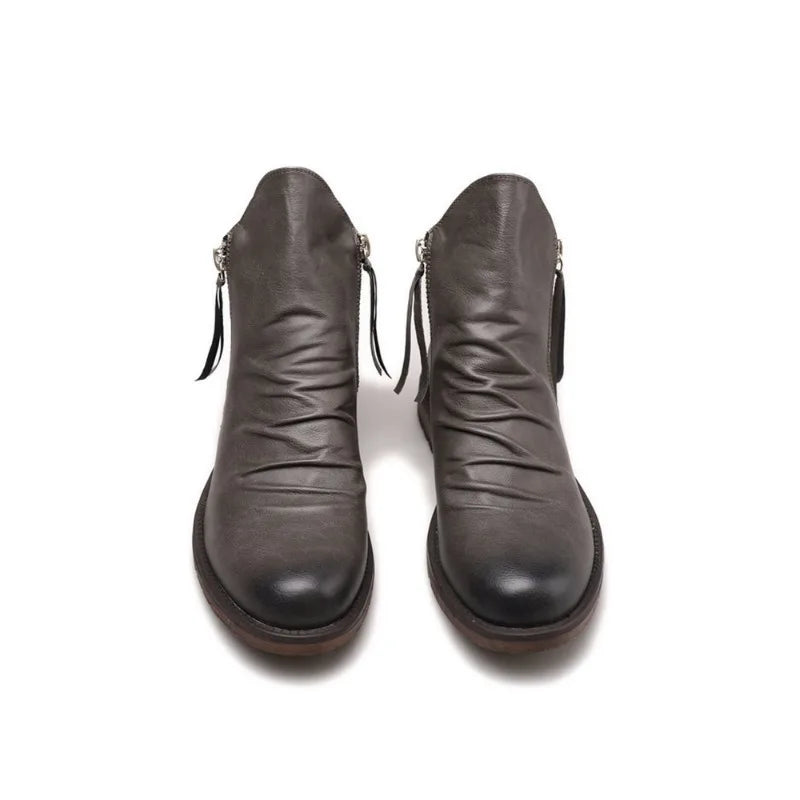 Keaton men's faux leather boots with a sleek Chelsea cut and a sturdy sole.
