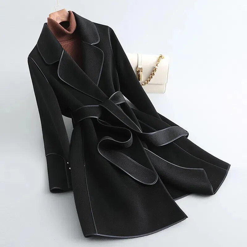 Amelia elegant women's long trench coat with a structured silhouette and a belted waist.
