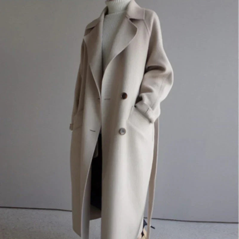 Althea women’s long coat with structured silhouette and minimalist details, chic and versatile design