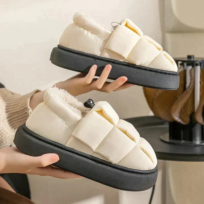 Esme comfortable indoor slippers with a plush, cozy interior and a refined design.