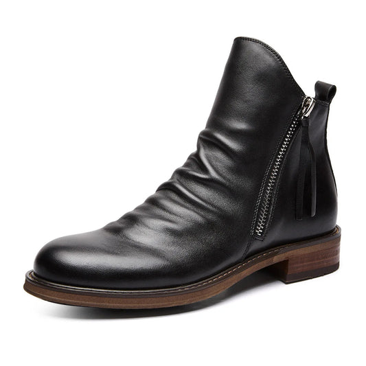 Keaton men's faux leather boots with a sleek Chelsea cut and a sturdy sole.