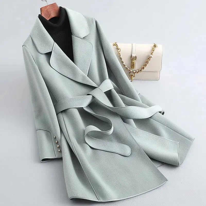 Amelia elegant women's long trench coat with a structured silhouette and a belted waist.