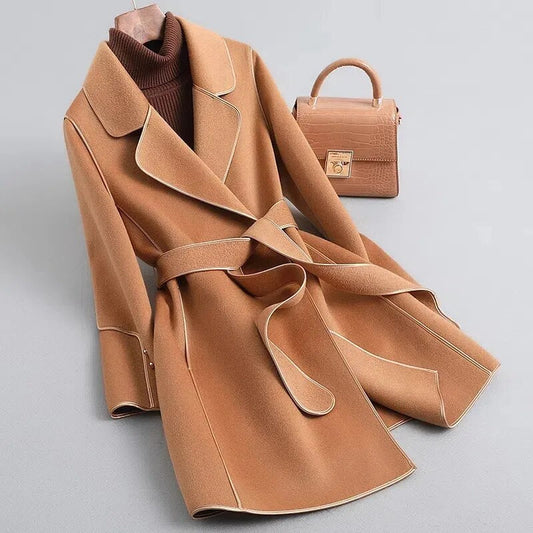 Amelia elegant women's long trench coat with a structured silhouette and a belted waist.