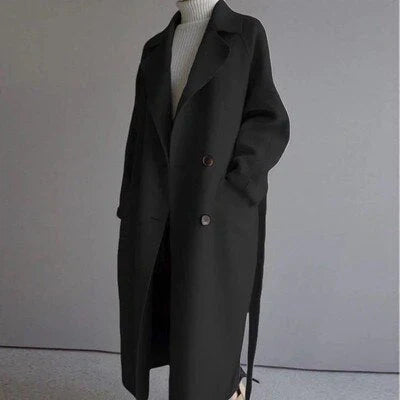 Althea women’s long coat with structured silhouette and minimalist details, chic and versatile design